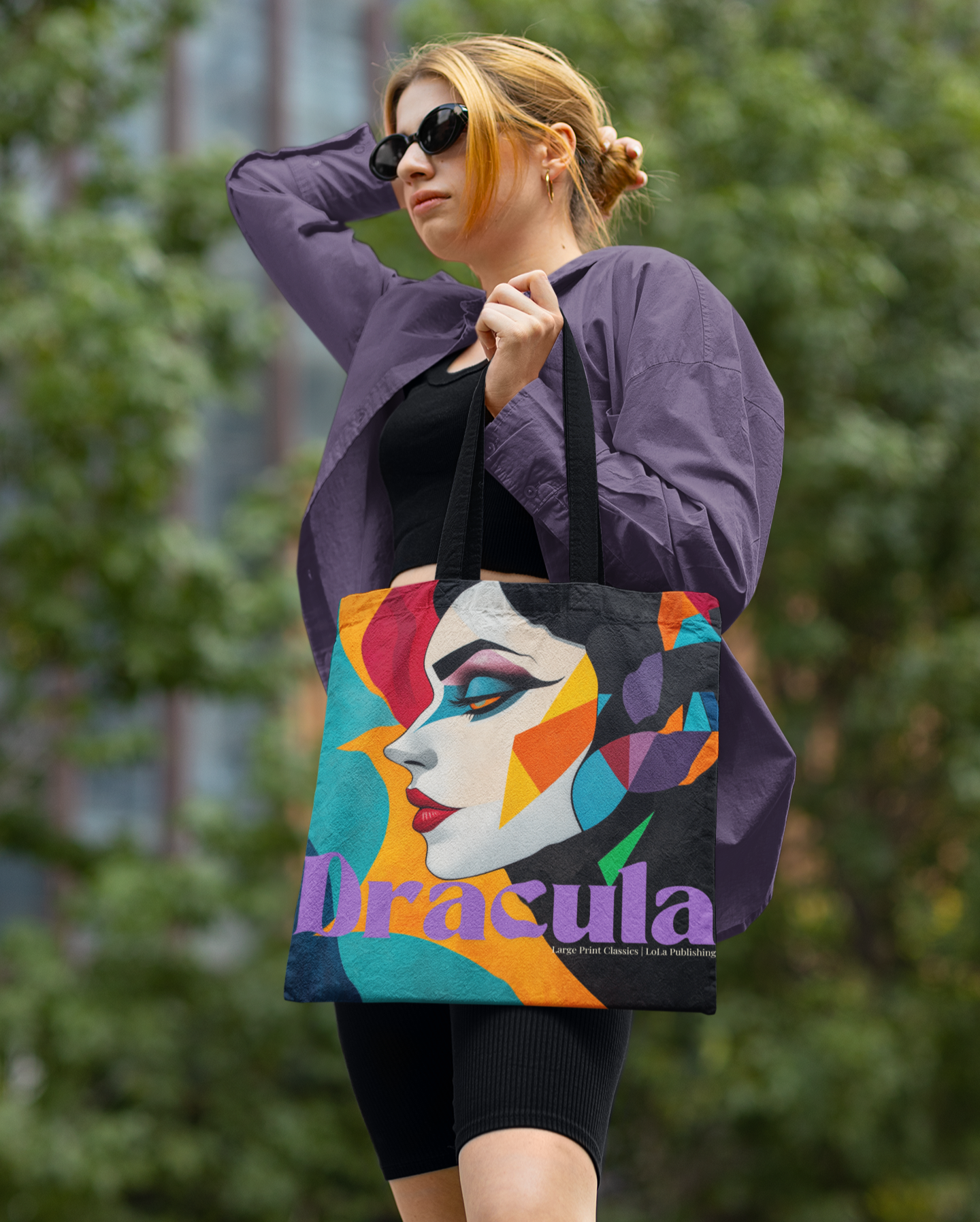 A woman carrying a Dracul's Bride Tote Bag; black handles.