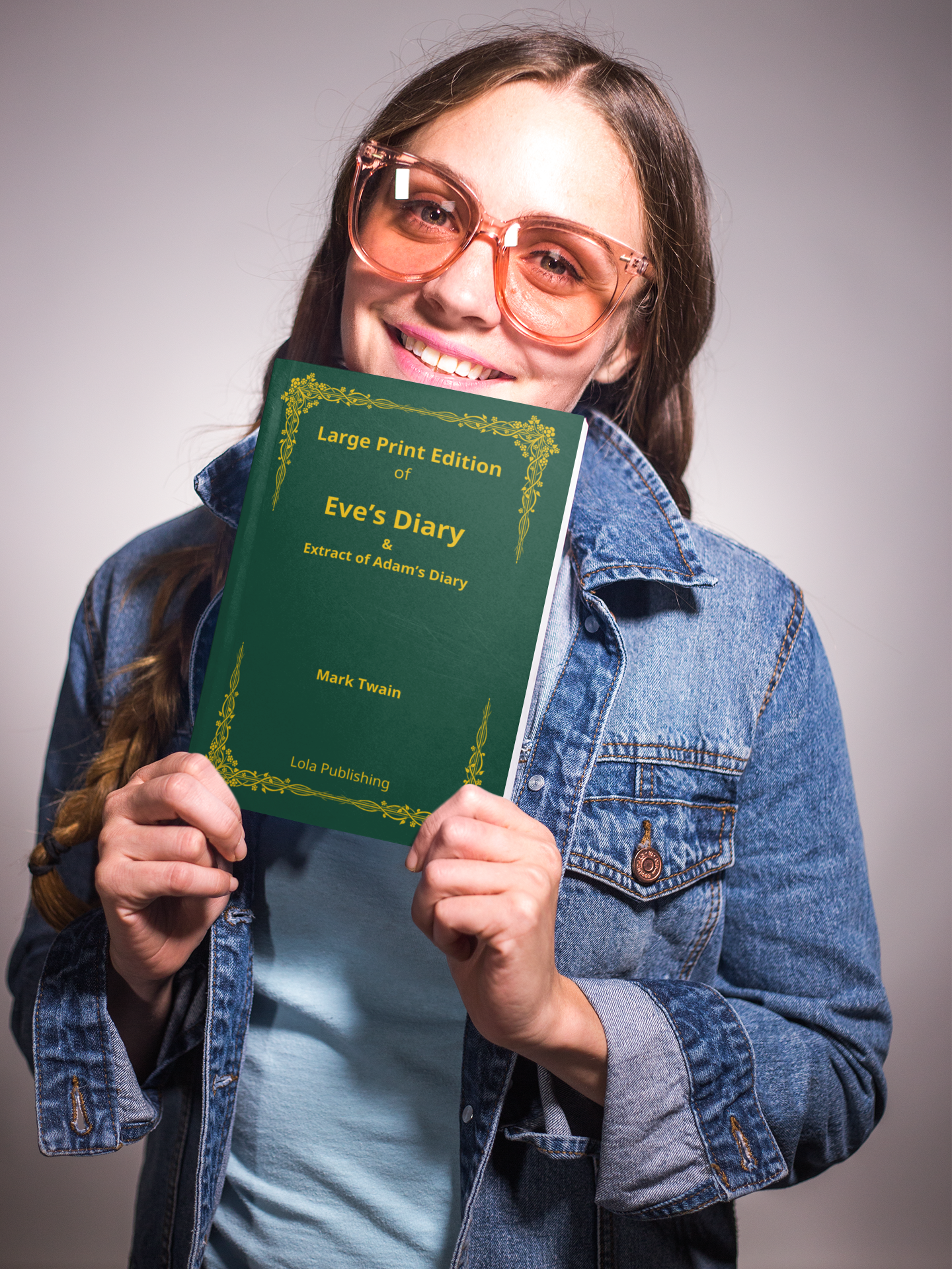 A woman holding a large print edition of Mark Twain's "Eve's Diary".