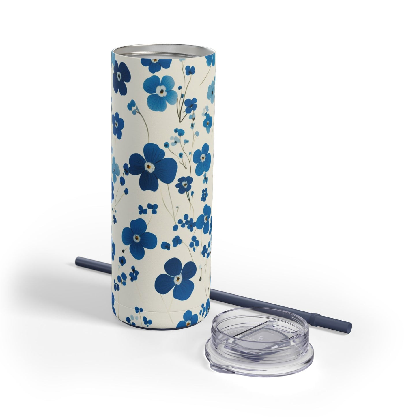 "Forget Me Nots Skinny Tumbler with a soft blue floral design, perfect for tea, coffee, or iced drinks. Double-wall insulated for temperature retention, ideal for travel, work, or relaxation."