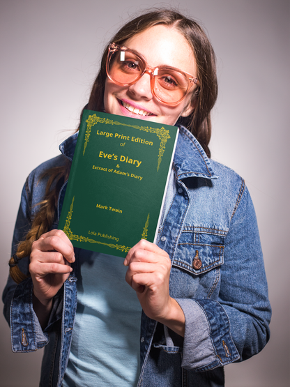 A woman holding  a large print edition of Mark Twain's "Eve's Diary".