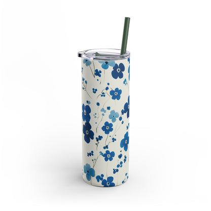 "Forget me nots Skinny Tumbler with a slim, ergonomic design and a seamless floral print. Fits comfortably in hand and cup holders."